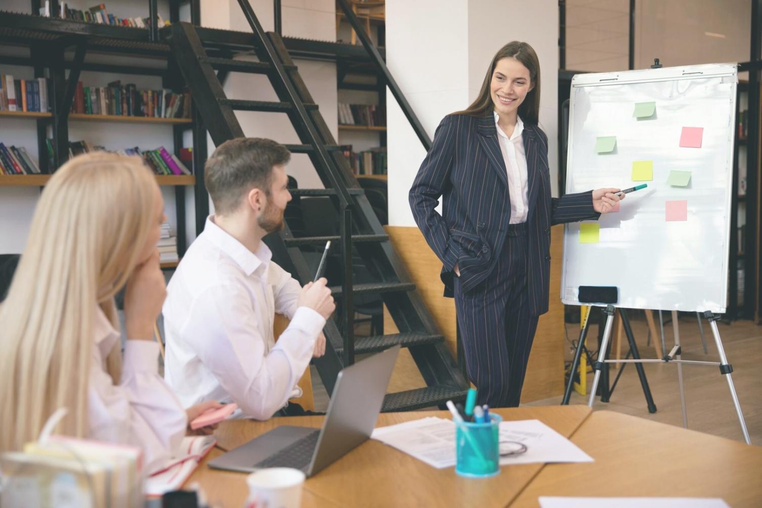 Financial forecasting classroom session with participants reviewing budget analysis results